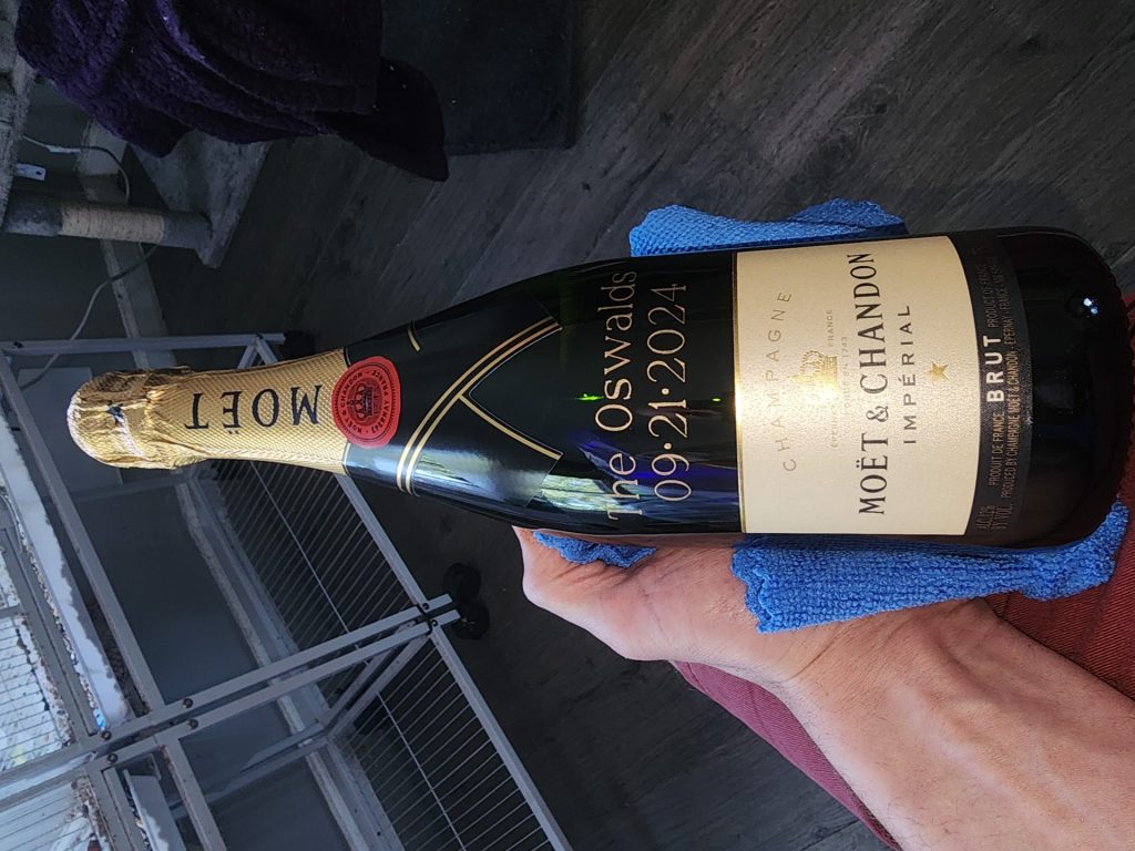 Champagne bottle with inscription